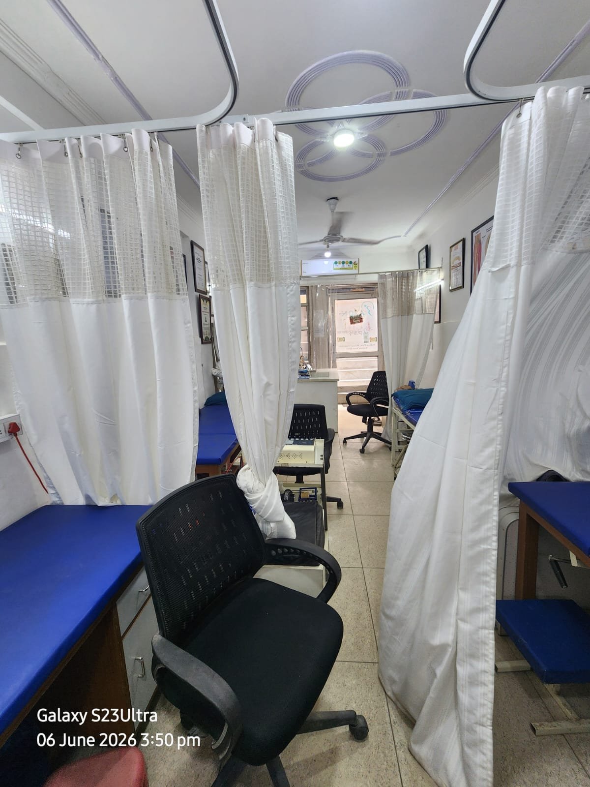 Clinic corridor with curtained beds